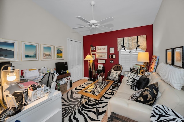 living room with light hardwood / wood-style floors, ceiling fan, and lofted ceiling