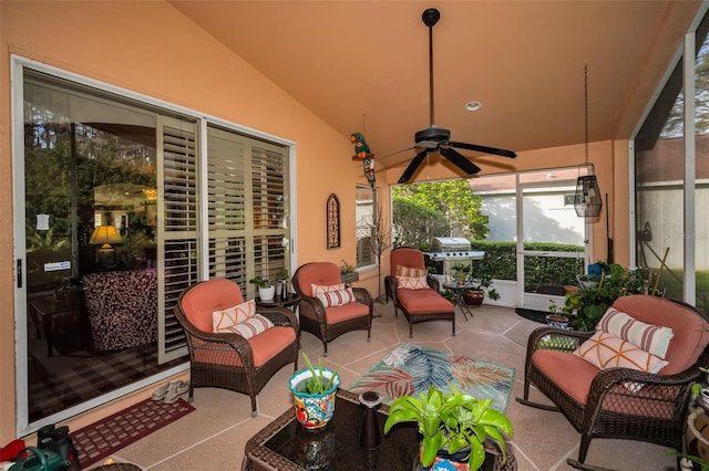 view of patio featuring ceiling fan, area for grilling, and an outdoor living space