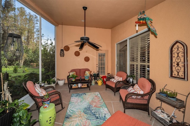 view of patio with an outdoor living space and ceiling fan