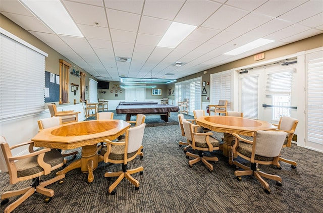 dining area featuring a drop ceiling