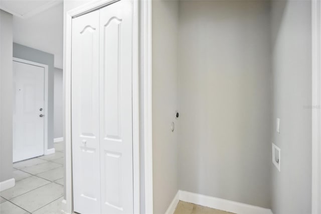 corridor featuring light tile patterned floors