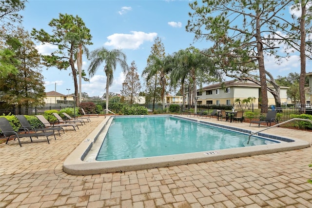 view of swimming pool featuring a patio