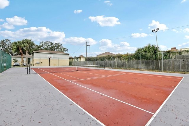 view of sport court featuring basketball hoop