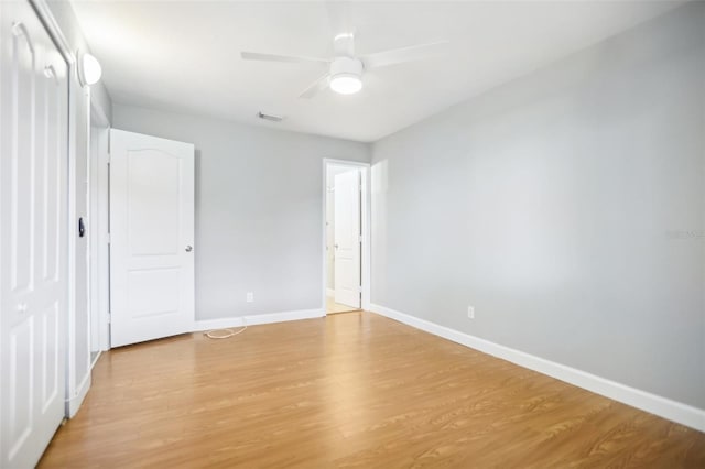 unfurnished bedroom with ceiling fan and light hardwood / wood-style flooring