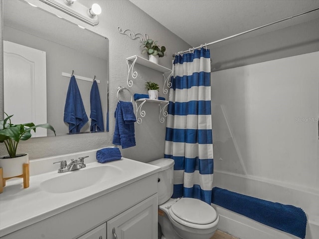 bathroom with a textured wall, toilet, vanity, and shower / tub combo with curtain