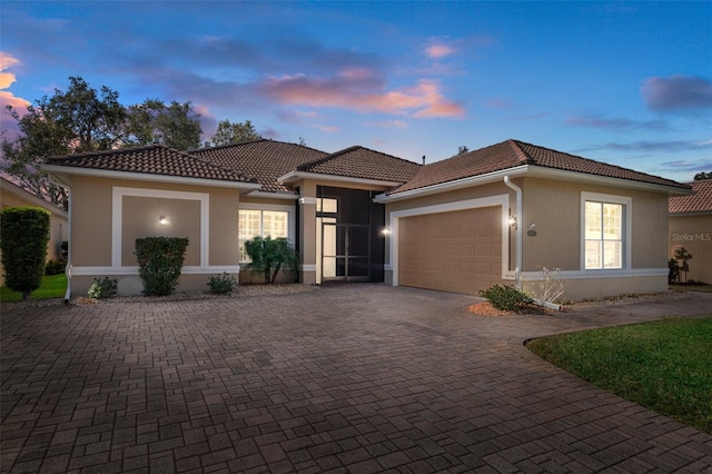 mediterranean / spanish-style home featuring a garage