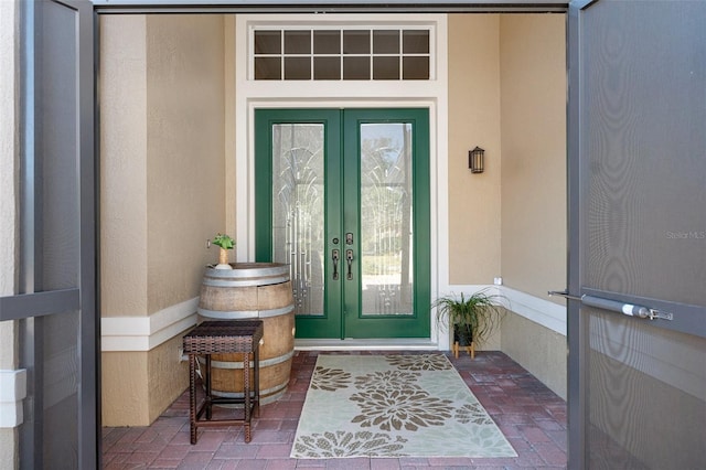 view of exterior entry featuring french doors