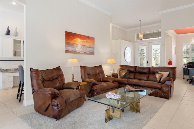 tiled living room featuring french doors and ornamental molding