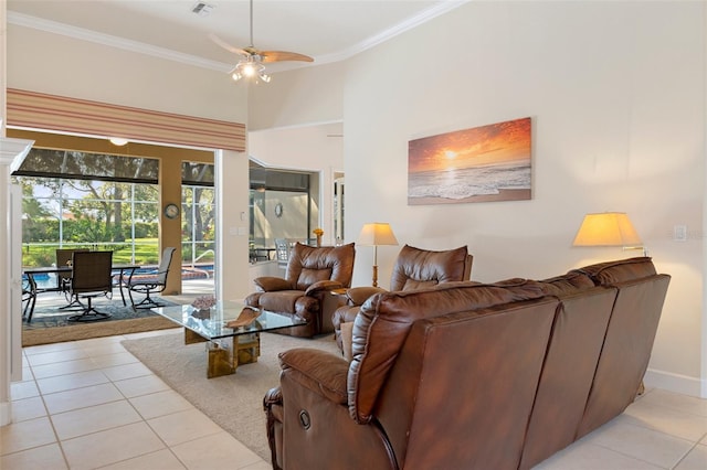 living room featuring ceiling fan, light tile patterned floors, and ornamental molding