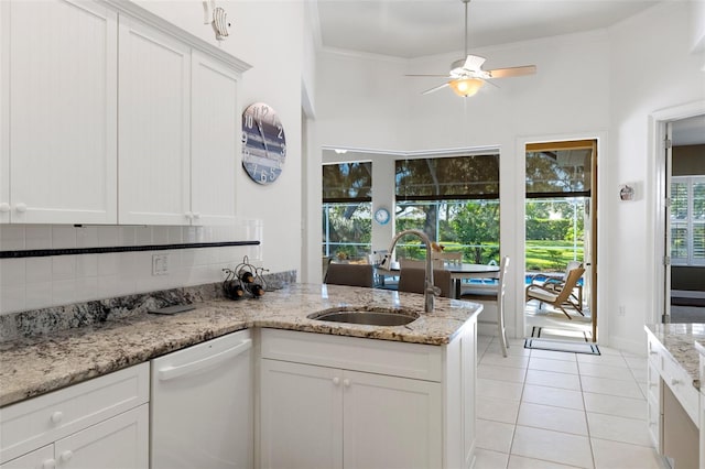 kitchen with dishwasher, sink, crown molding, decorative backsplash, and white cabinetry