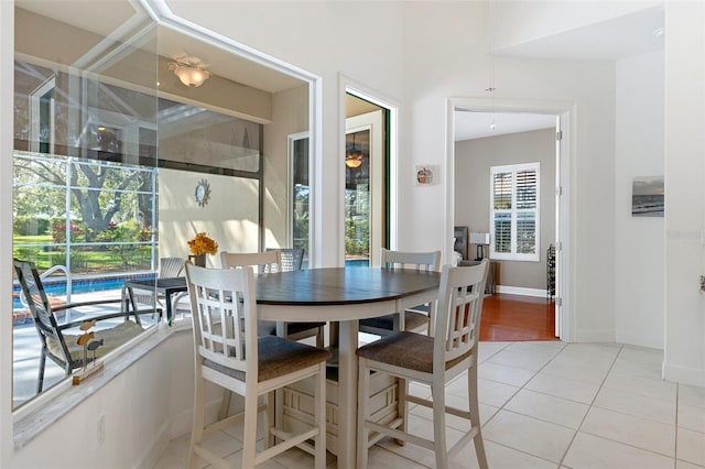 dining area featuring light tile patterned floors