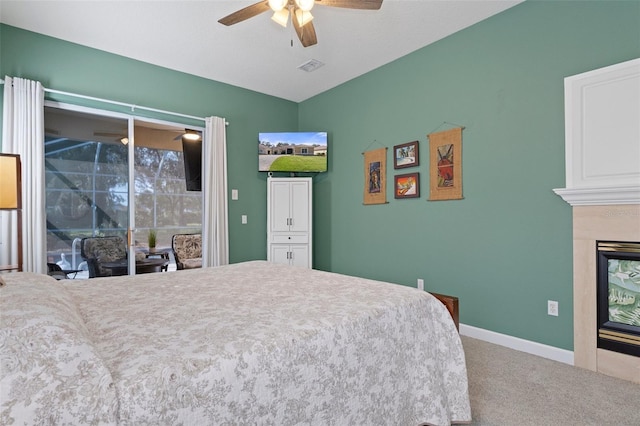 bedroom with access to exterior, carpet floors, and ceiling fan