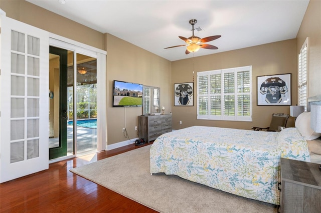 bedroom with access to exterior, hardwood / wood-style flooring, and ceiling fan