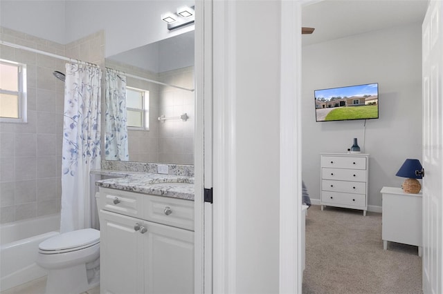 full bathroom featuring shower / bathtub combination with curtain, a wealth of natural light, vanity, and toilet