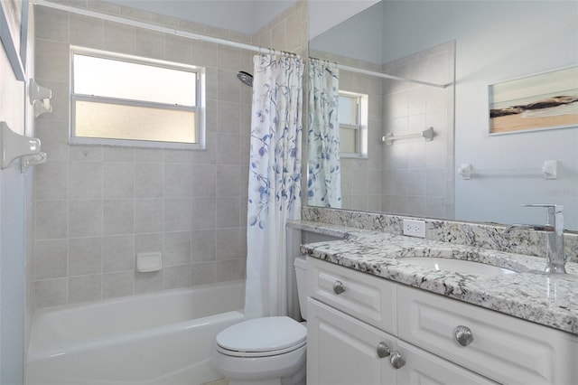 full bathroom featuring shower / bath combination with curtain, vanity, and toilet