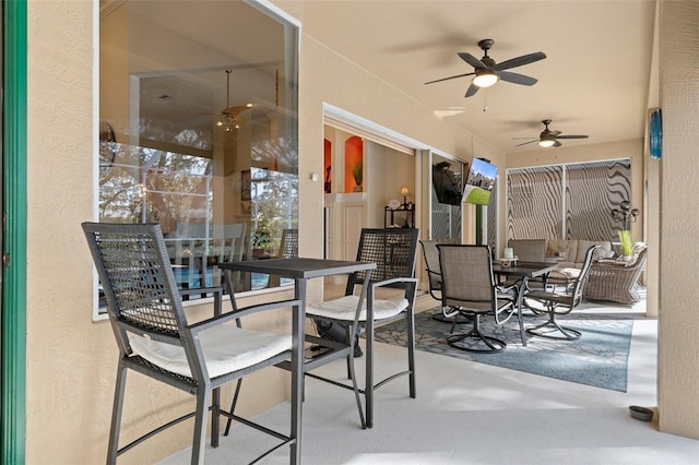 view of patio / terrace featuring ceiling fan