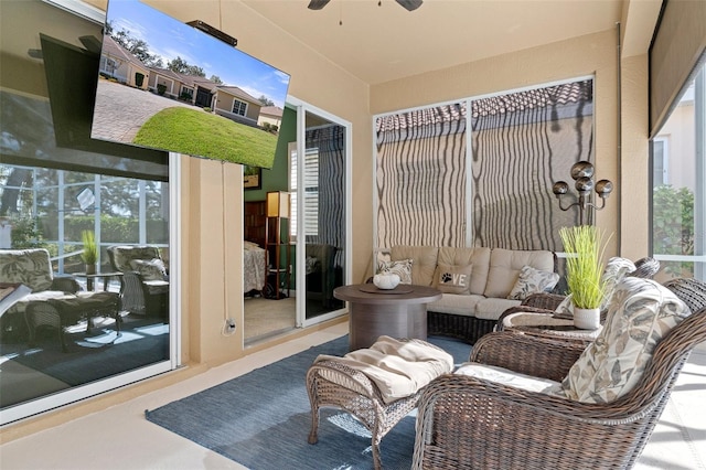 sunroom / solarium with ceiling fan