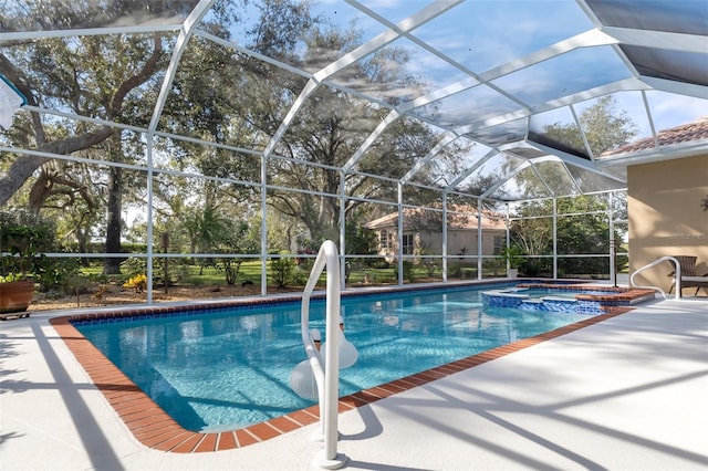 view of swimming pool with a lanai, an in ground hot tub, and a patio