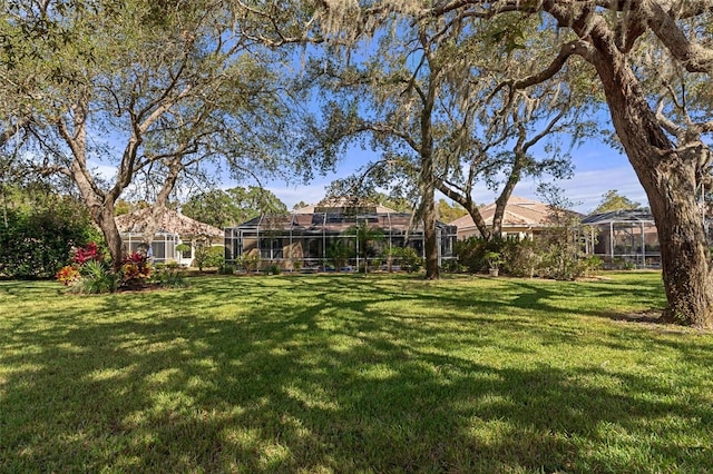 view of yard with a lanai