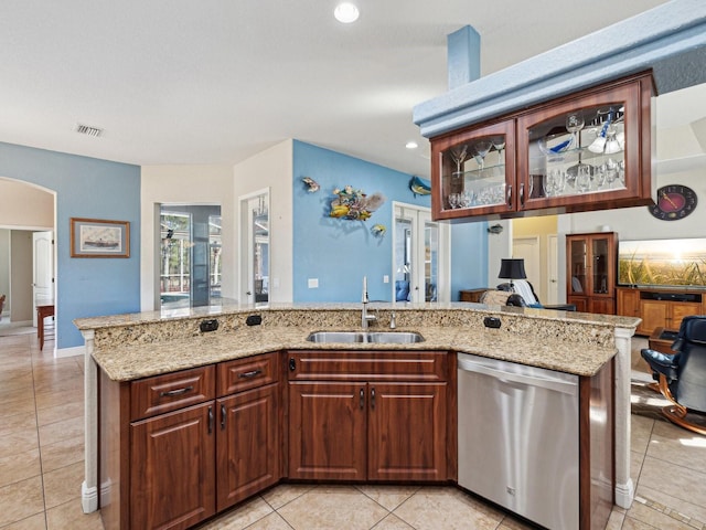 kitchen with sink, stainless steel dishwasher, kitchen peninsula, and light tile patterned flooring