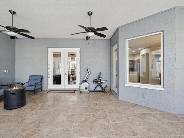 view of patio / terrace with ceiling fan and french doors