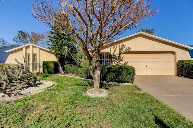 single story home with a front lawn and a garage