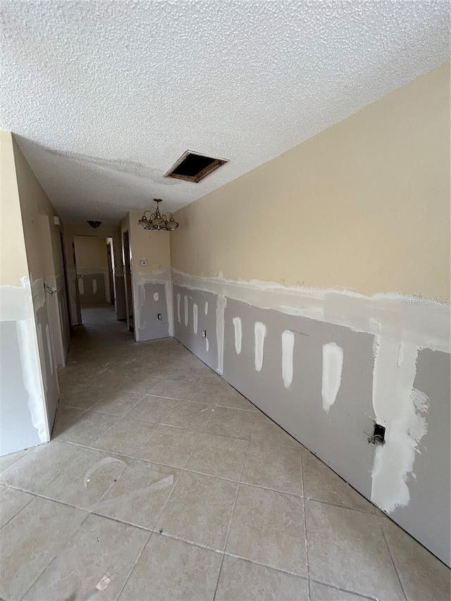 empty room with a textured ceiling