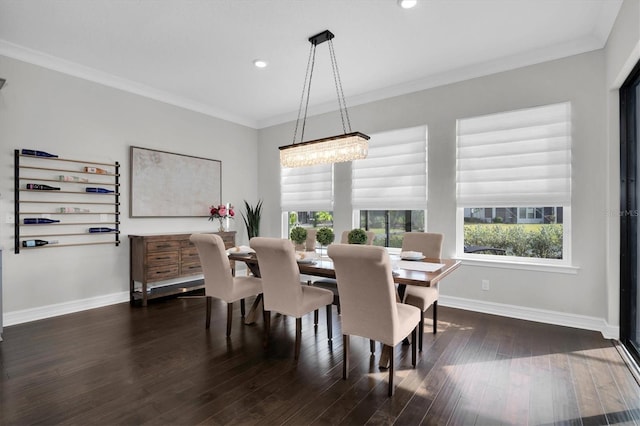 dining room with a chandelier, dark hardwood / wood-style floors, and ornamental molding