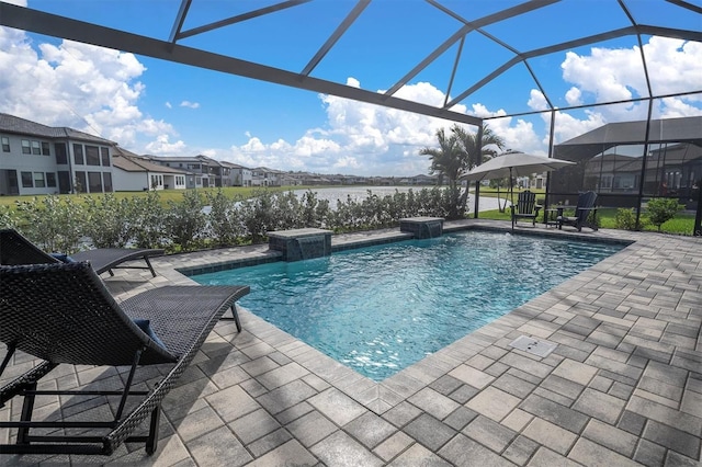 view of swimming pool with glass enclosure, pool water feature, and a patio