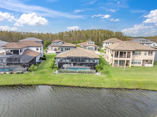 birds eye view of property with a water view