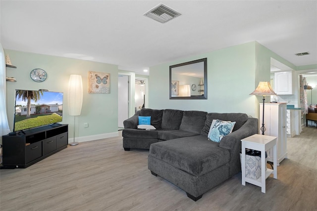 living room featuring light wood-type flooring