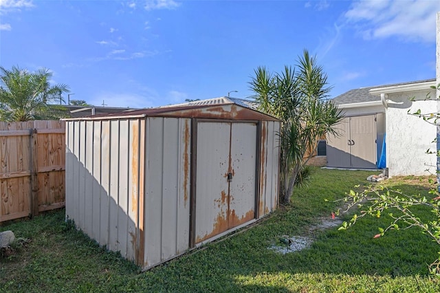 view of outdoor structure featuring a yard