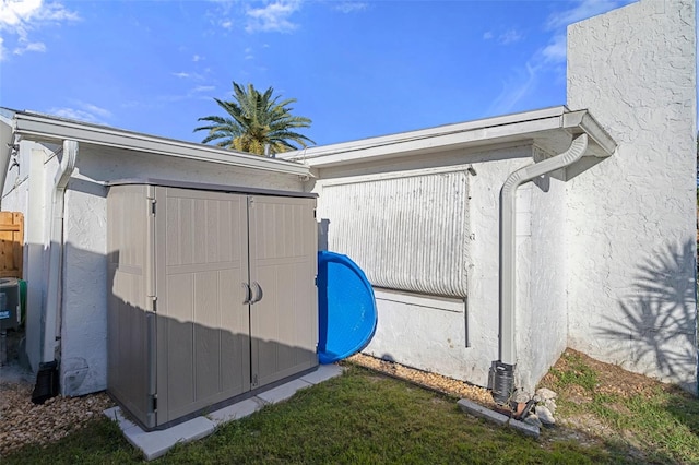 view of property exterior featuring a shed