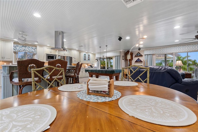 dining room featuring ceiling fan and pool table