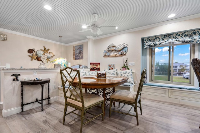 dining area featuring ceiling fan, ornamental molding, wood ceiling, and light hardwood / wood-style flooring