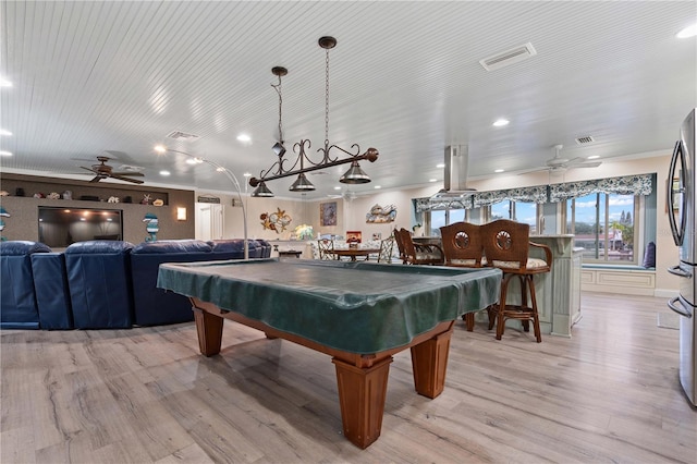 recreation room with light hardwood / wood-style floors, ceiling fan, crown molding, and billiards