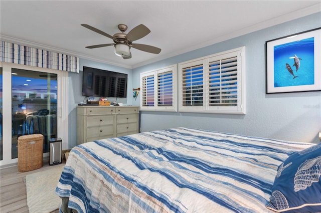 bedroom with ceiling fan, crown molding, and light hardwood / wood-style flooring