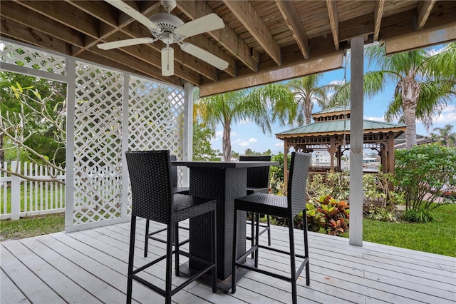 deck featuring a gazebo and ceiling fan