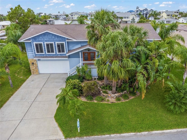 view of front of house with a front lawn and a garage