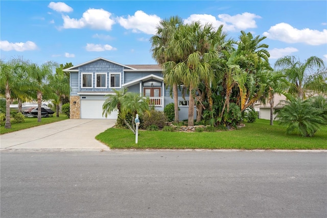 view of front facade featuring a front lawn and a garage