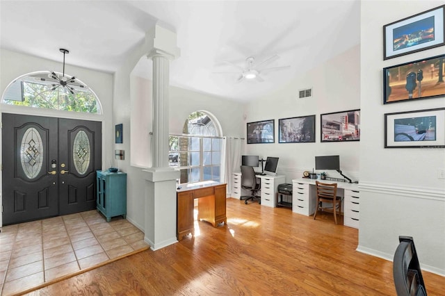 entryway with ceiling fan, ornate columns, french doors, and light hardwood / wood-style flooring