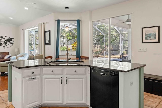 kitchen featuring dark stone countertops, white cabinetry, black dishwasher, and light tile patterned floors