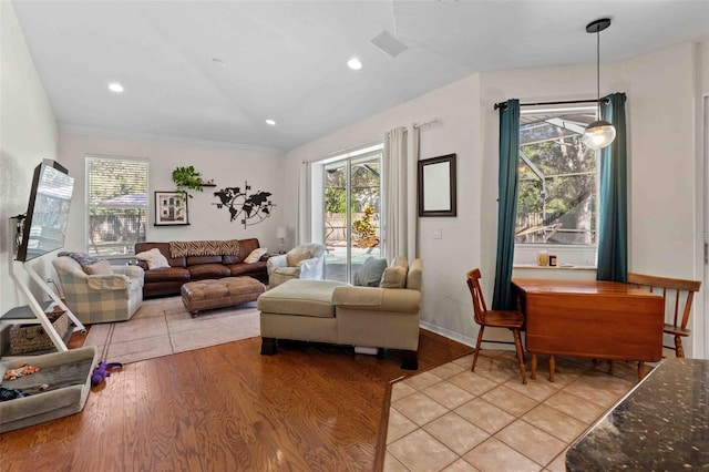 living room featuring light wood-type flooring and ornamental molding