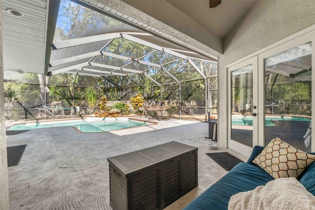 view of swimming pool with a patio and a lanai