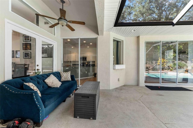 exterior space featuring an outdoor living space and ceiling fan