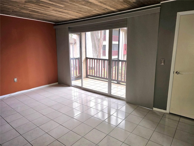 unfurnished room featuring light tile patterned flooring and wooden ceiling