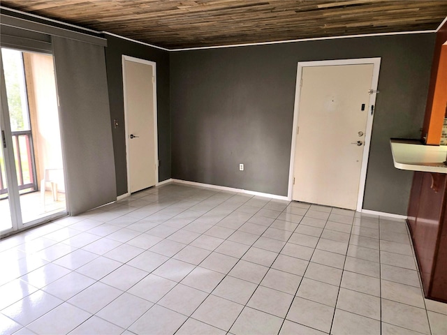 unfurnished room featuring light tile patterned flooring and wooden ceiling