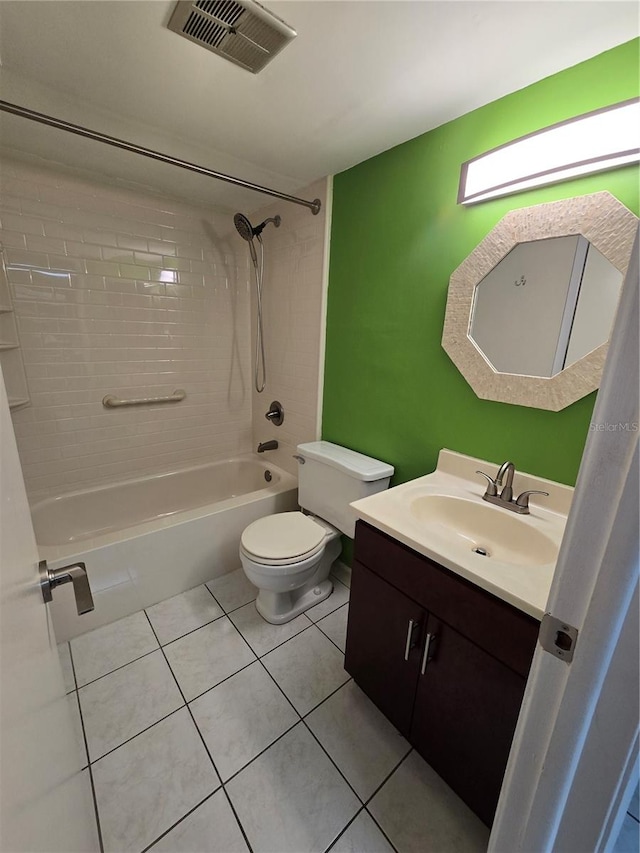 full bathroom with tile patterned flooring, vanity, toilet, and tiled shower / bath