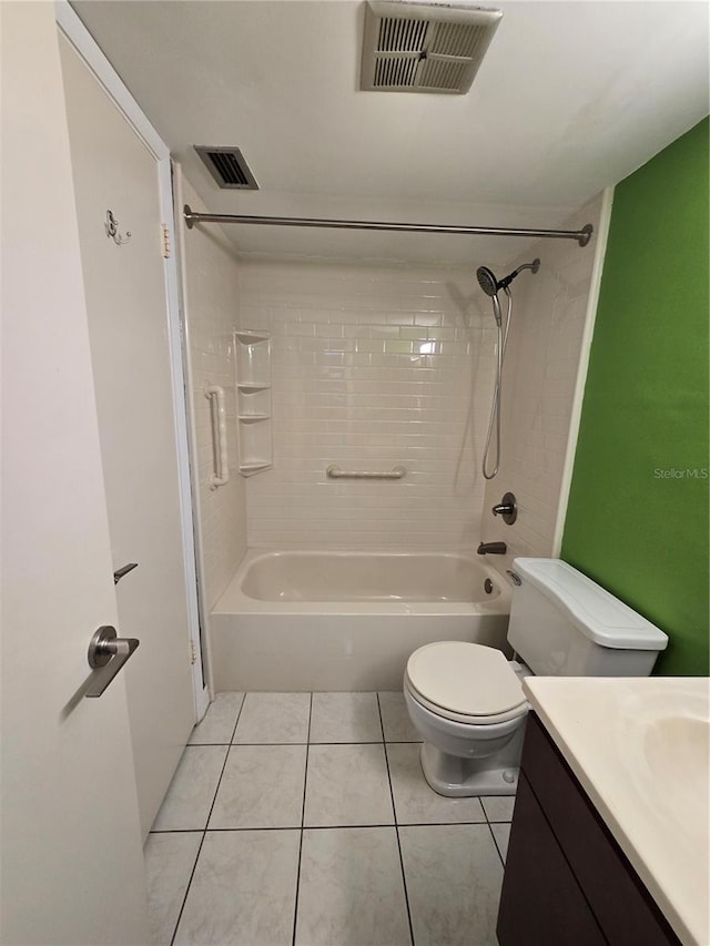 full bathroom with tile patterned flooring, vanity, toilet, and tiled shower / bath