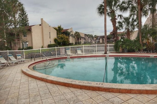 view of pool featuring a patio area